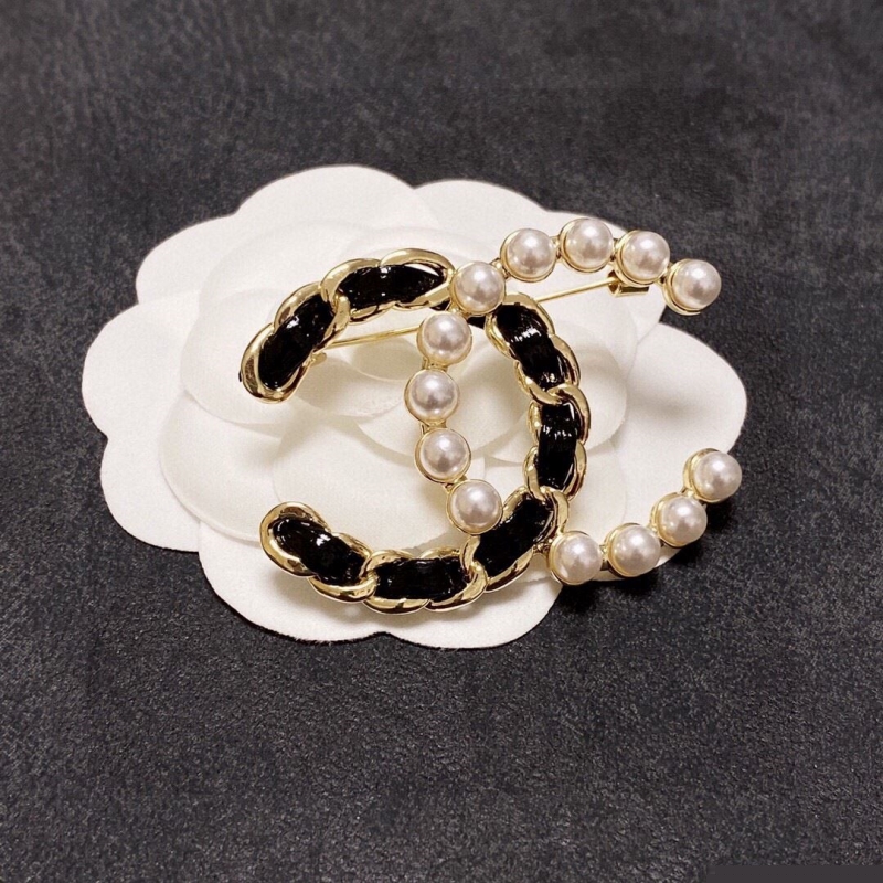 Ch*el brooches